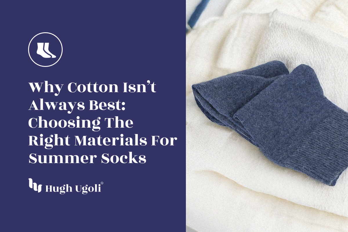 Folded pair of navy Hugh Ugoli socks resting on soft ivory fabrics — highlighting alternative sock materials beyond cotton for enhanced comfort in summer heat